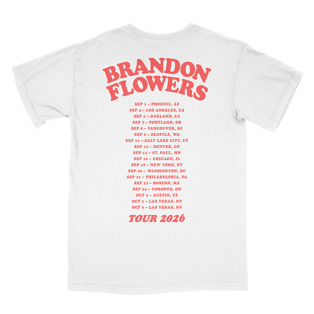 A white short-sleeve T-shirt shown from the back, featuring large red text reading 'BRANDON FLOWERS' with a smaller red 2026 tour city list printed below.