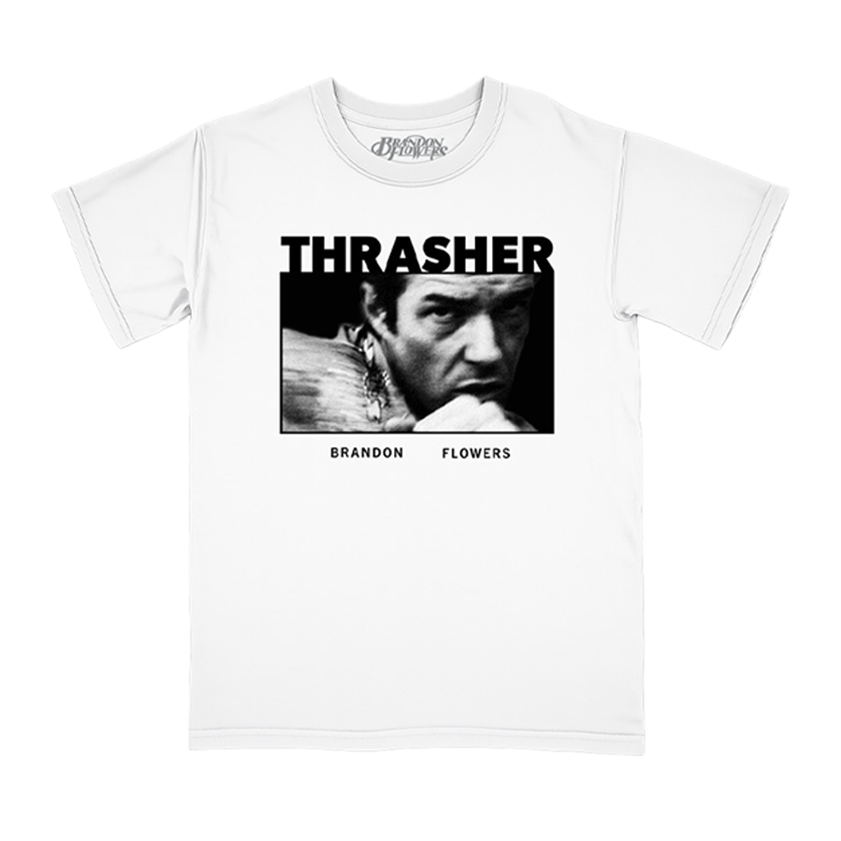 A white short-sleeve crewneck t-shirt featuring a black and white graphic print of a Brandon Flowers under the word 'THRASHER' and above 'BRANDON FLOWERS'.